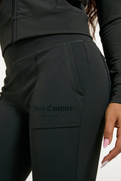 Displays a model wearing the Raven 'Juicy' branded Active Low Rise Pant