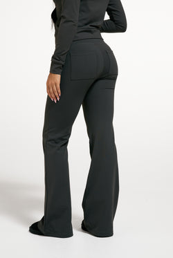 Displays a model wearing the Raven 'Juicy' branded Active Low Rise Pant