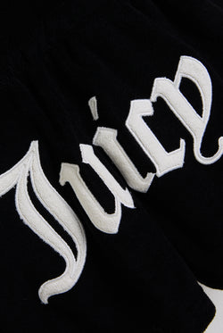 Displays the Black Appliqué 'Juicy' branded Terry towelling romper featuring the juicy branding 
