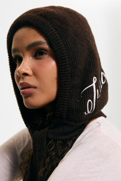 Displays a model wearing the Java 'Juicy' branded Bonnet With Bow