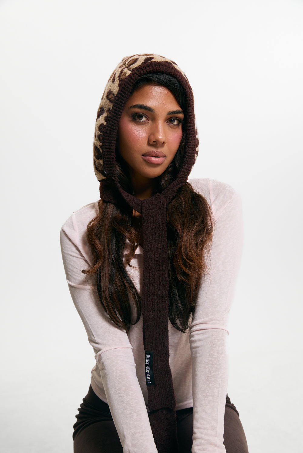 Displays a model wearing the Leopard Print 'Juicy' branded Bonnet With Bow