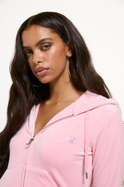Displays a model wearing the Juicy Pink 'Juicy' branded bridesmaid classic velour hoodie 