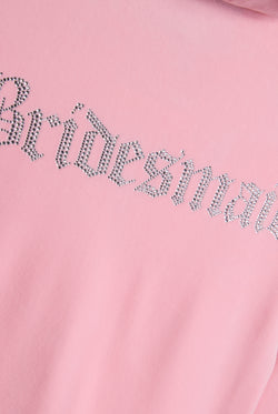 Displays the Juicy Pink 'Juicy' branded bridesmaid classic velour hoodie featuring the juicy branding 'bridesmaid' logo