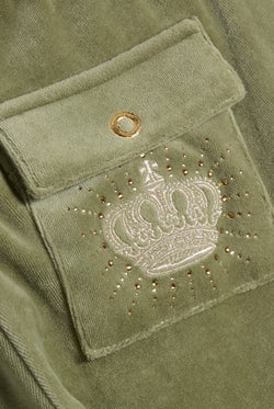 Displays the Oil Green 'Juicy' branded Regal Rebelle Caisa Ultra Low Rise Pant featuring the juicy couture branding