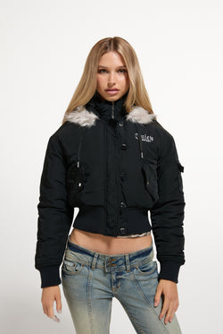 Displays a model wearing the Black 'Juicy' branded Nylon Bomber