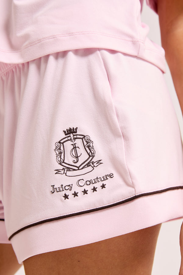 Displays a model wearing the Cherry Blossom 'Juicy' branded chateau shorts included in the pyjama set