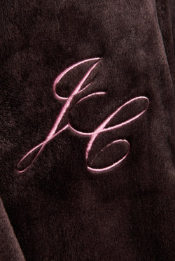 Displays the Java 'Juicy' branded crown plush hooded robe featuring the juicy branding 