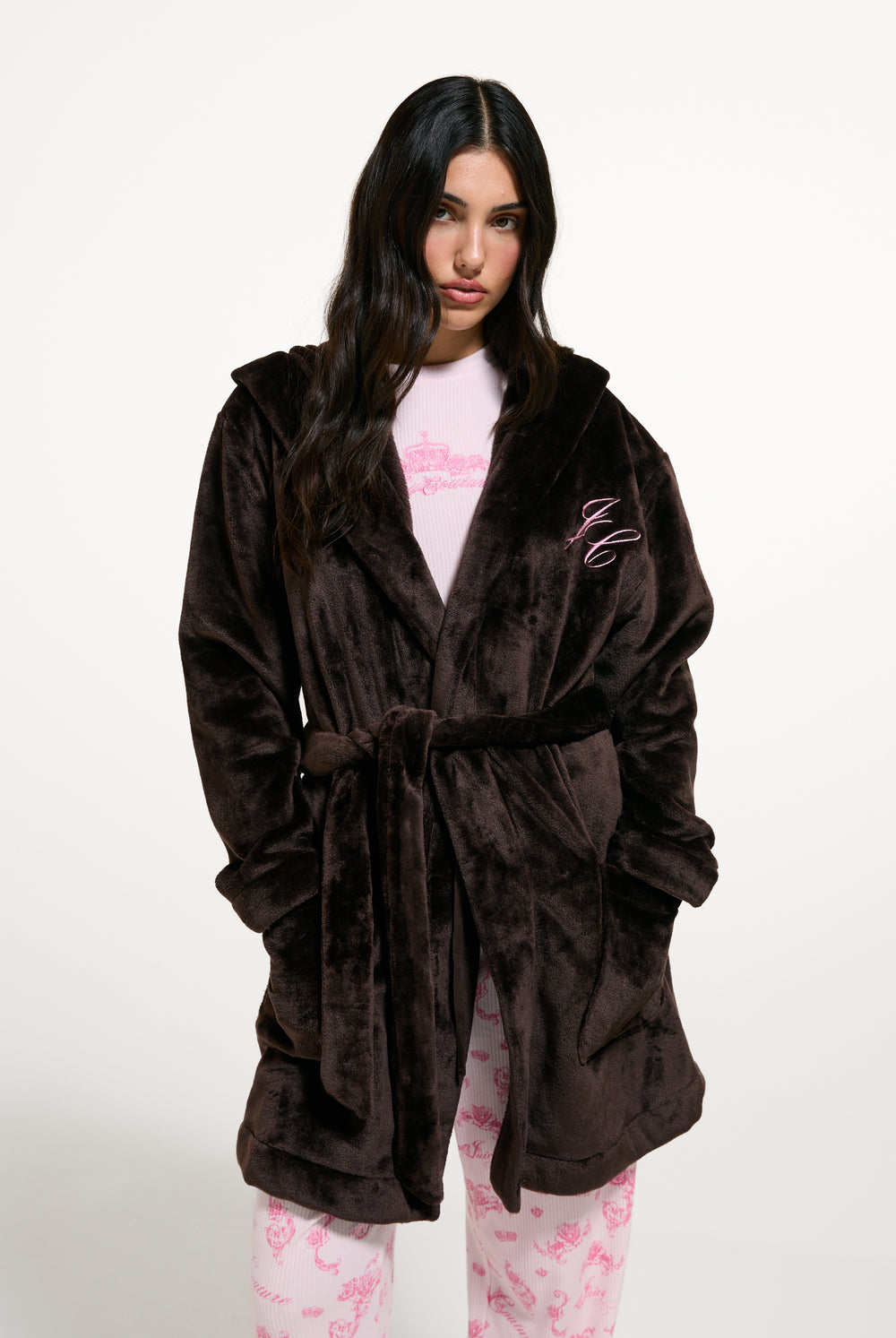 Displays a model wearing the Java 'Juicy' branded crown plush hooded robe 
