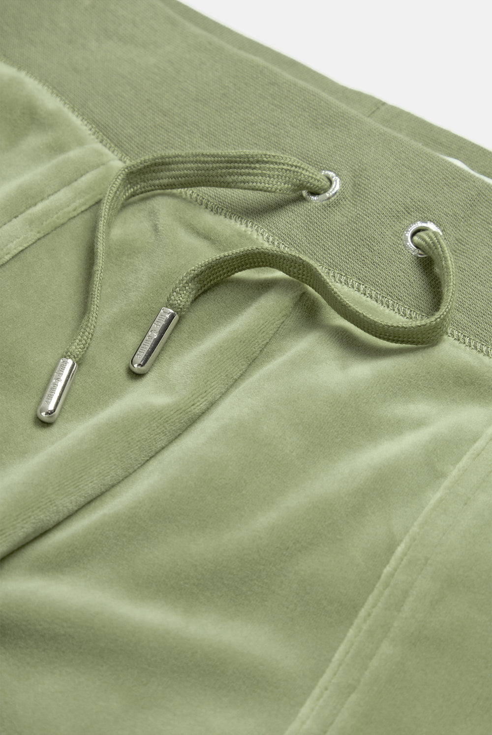 Displays the Oil Green 'Juicy' branded Classic Velour Del Ray Pocketed Bottoms featuring the close up on the details