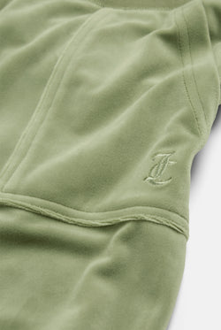 Displays the Oil Green 'Juicy' branded Classic Velour Del Ray Pocketed Bottoms featuring the close up on the juicy branding 