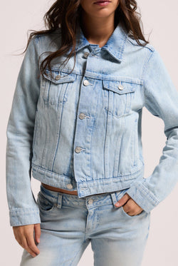 Displays a model wearing the light wash 'Juicy' branded stretch denim fitted jacket