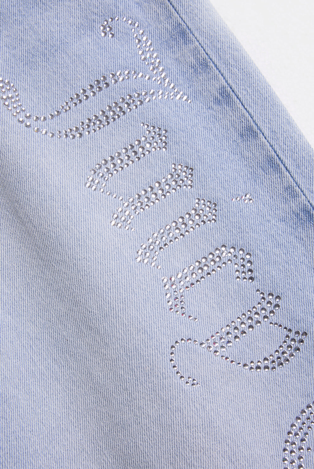 Displays the Light Wash Diamanté 'Juicy' branded wide leg jeans 