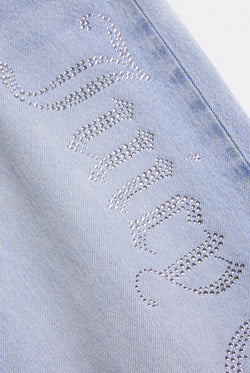 Displays the Light Wash Diamanté 'Juicy' branded wide leg jeans 