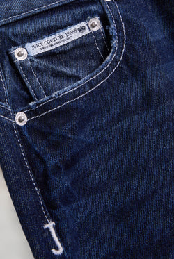 Displays the mid Wash 'Juicy' branded wide leg Diamanté jeans 