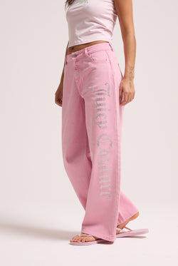 Displays a model wearing the Pink Wash 'Juicy' branded Diamanté wide leg jeans 