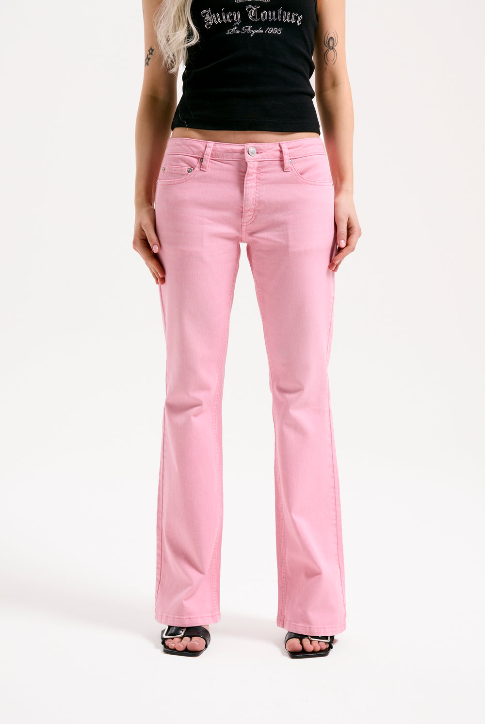 Displays the Pink Wash 'Juicy' branded Digi Diamanté mid rise flared jeans