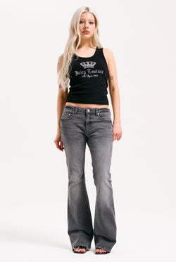 Displays a model wearing the grey wash 'Juicy' branded Digi diamanté mid rise flared jeans 