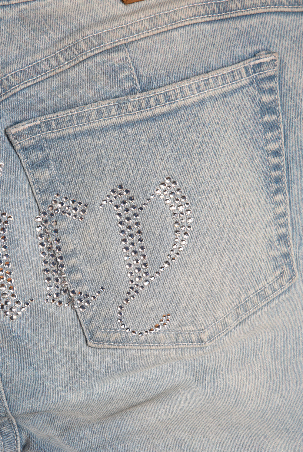 Displays he light wash 'Juicy' branded Diamanté low rise flare jeans featuring the juicy branding