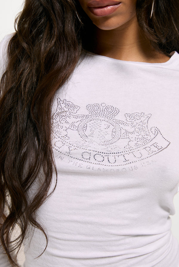 Displays a model wearing the White 'Juicy' branded Diamanté Dog Crest Long Sleeve T-Shirt
