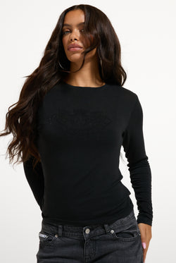 Displays a model wearing the Black 'Juicy' branded Diamanté Dog Crest Long Sleeve T-Shirt