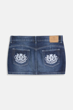 Displays the Mid Wash 'Juicy' branded dog crest mini skirt