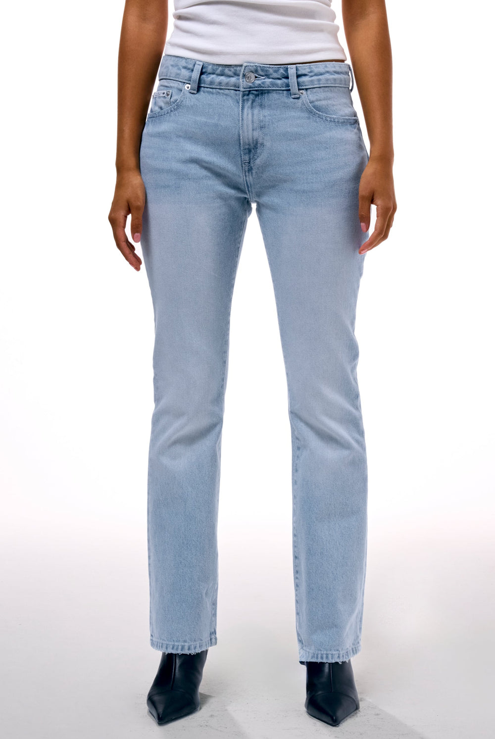 Displays a model wearing the Light Wash 'Juicy' branded Dog crest bootcut jeans