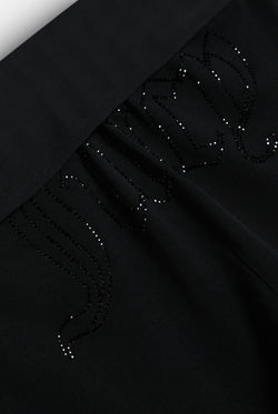 Displays the Black 'Juicy' branded Belted Flare Trousers featuring the juicy branding 