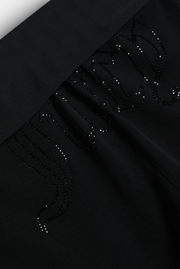 Displays the Black 'Juicy' branded Belted Flare Trousers featuring the juicy branding 