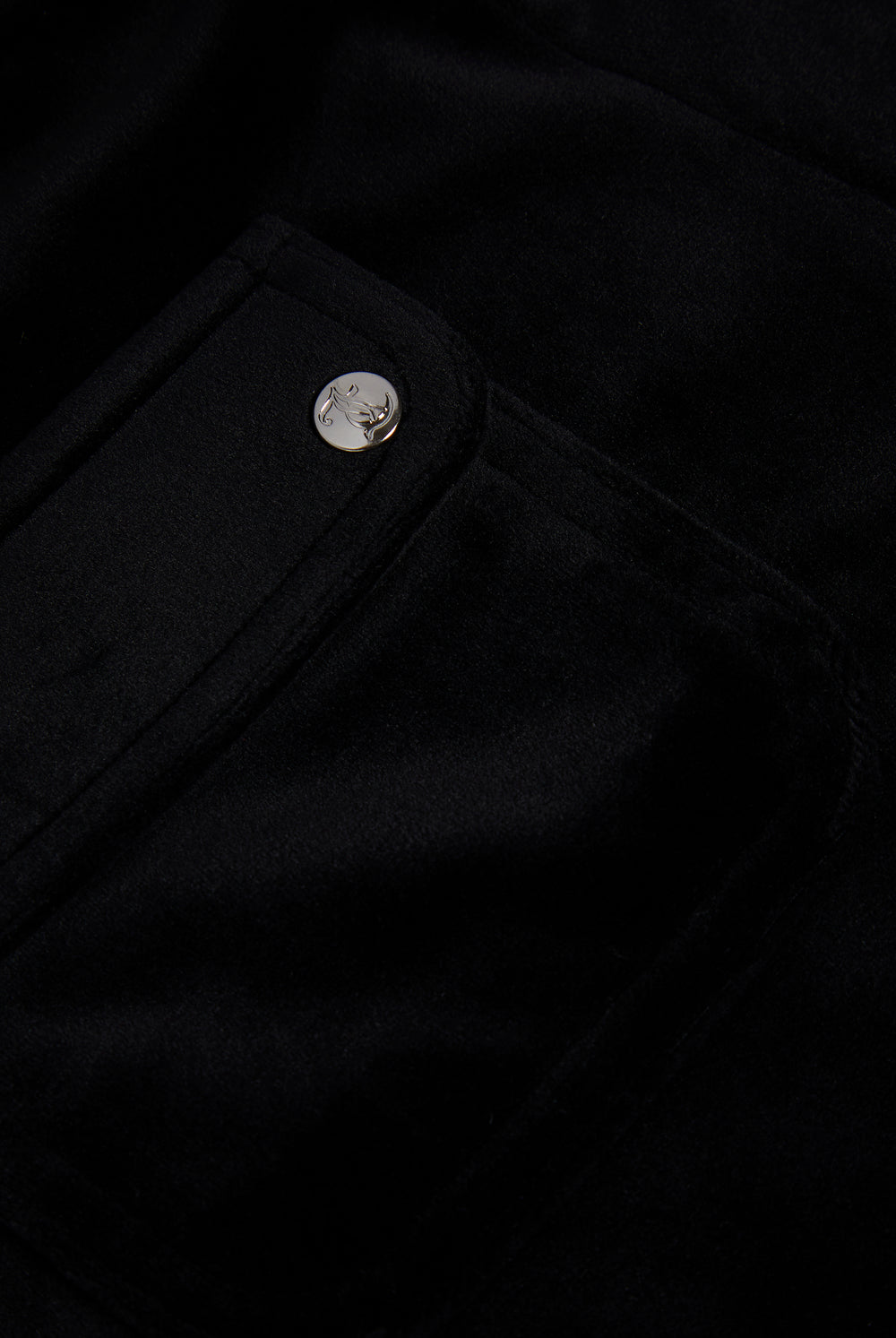 Displays the Black 'Juicy' branded classic velour track short with back pocket featuring the juicy logo