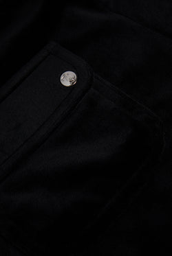 Displays the Black 'Juicy' branded classic velour track short with back pocket featuring the juicy logo