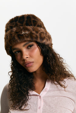 Displays a model wearing the Leopard Print 'Juicy' branded Faux Fur Hat
