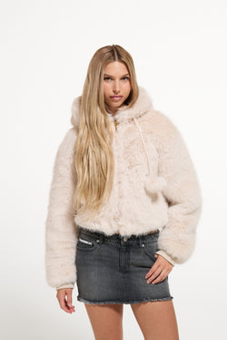 Displays a model wearing the Natural 'Juicy' branded Fur Hooded Faux Fur Jacket