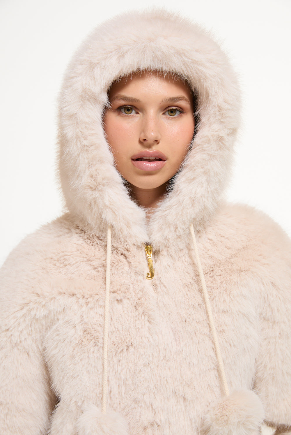 Displays a model wearing the Natural 'Juicy' branded Fur Hooded Faux Fur Jacket
