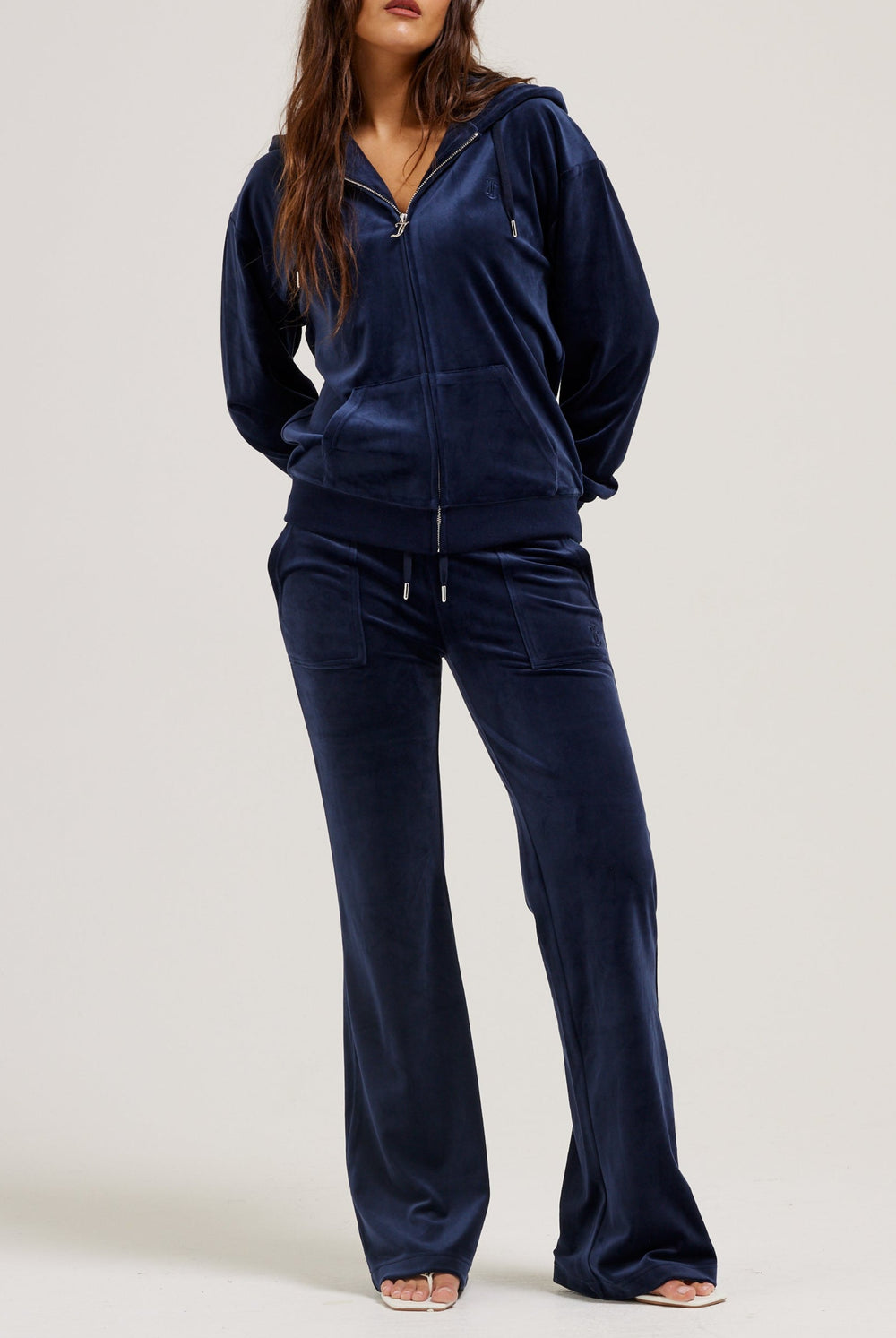Displays a model wearing the Night Sky 'Juicy' branded classic velour oversized hoodie 