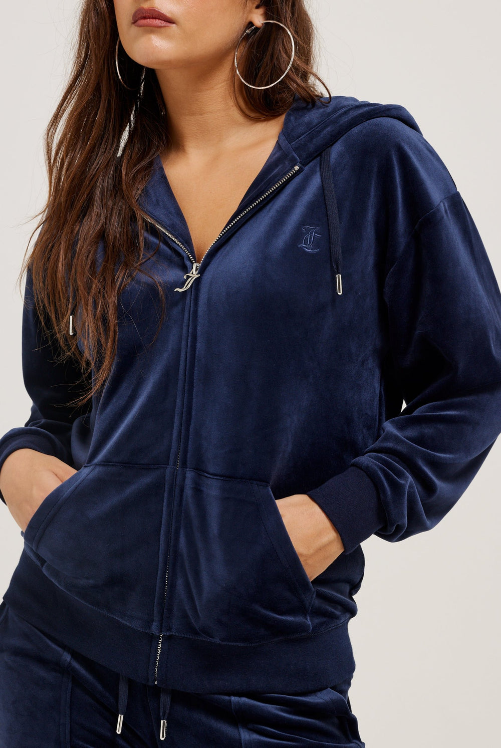 Displays a model wearing the Night Sky 'Juicy' branded classic velour oversized hoodie 