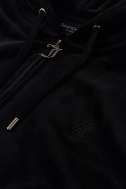 Displays the black classic 'Juicy' branded velour oversized hoodie featuring the juicy zip