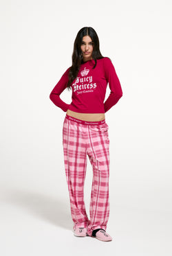 Displays a model wearing the Persian Red 'Juicy' branded Heiress Pyjama Set