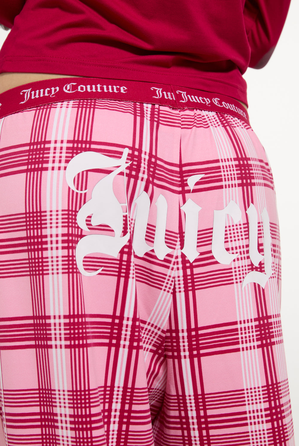 Displays a model wearing the Persian Red 'Juicy' branded Heiress Pyjama Set featuring the juicy branding 
