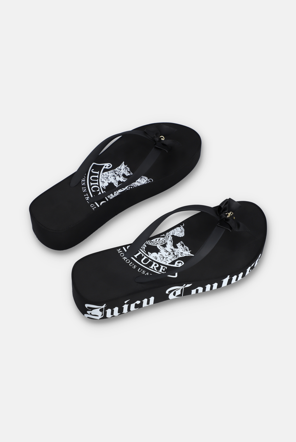 Displays a pair of the Black Heritage 'Juicy' branded wedge slides