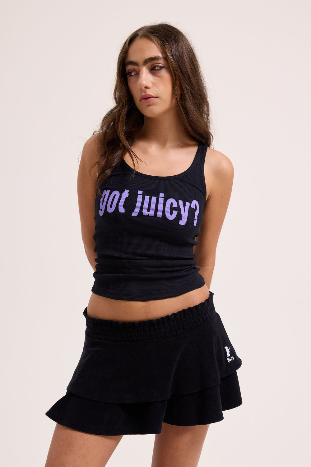 Displays a model wearing the Black Heritage 'Juicy' branded smoked tier skirt
