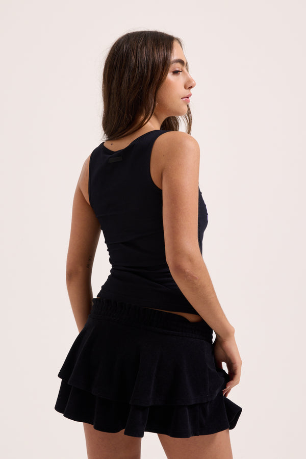 Displays a model wearing the black 'Juicy' branded Got Juicy rib vest 
