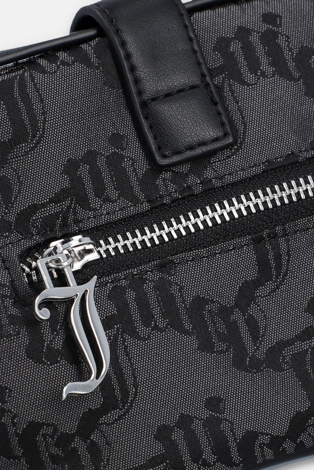 Displays the Black jacquard 'Juicy' branded soft buckle bag featuring the juicy zip 