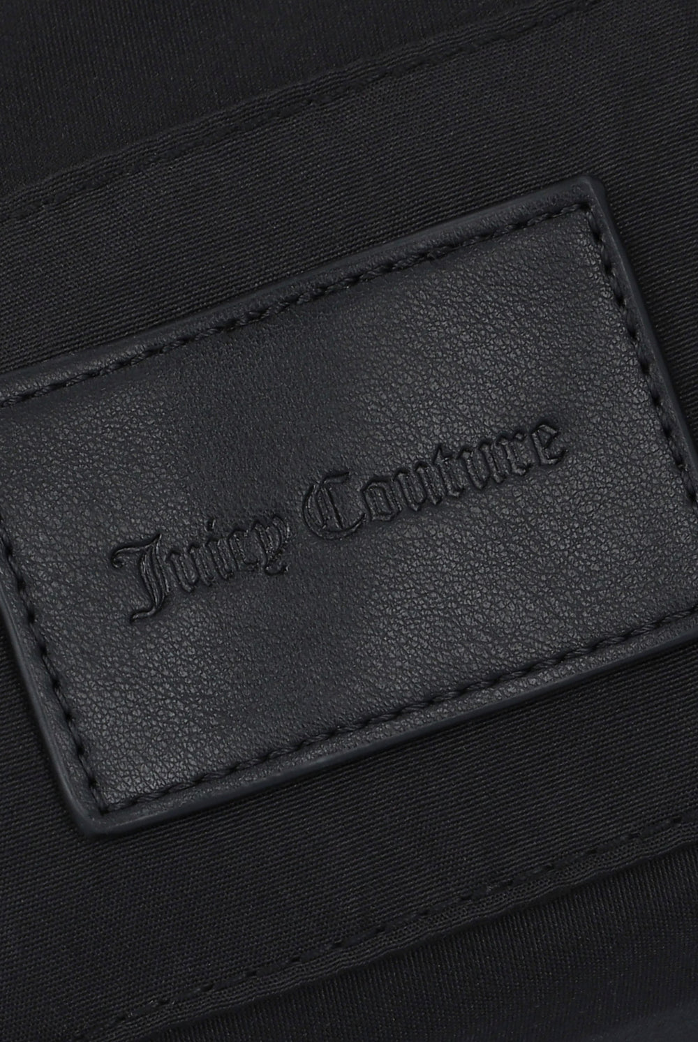 Displays the Black jacquard 'Juicy' branded soft buckle bag featuring the juicy couture 