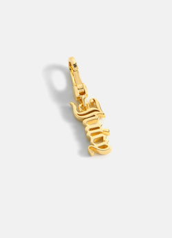 Displays the Gold 'Juicy' branded juicy charm 
