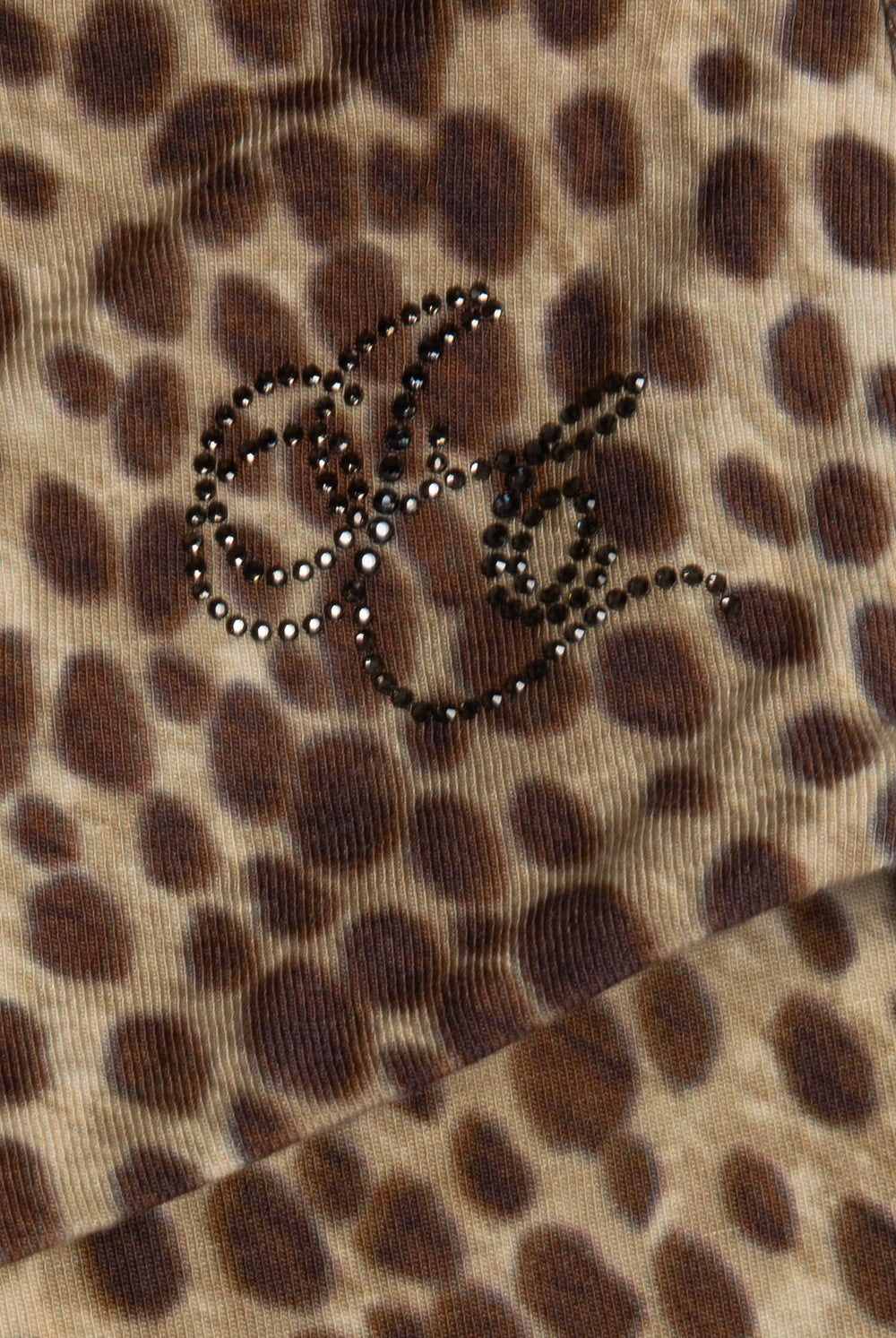 Displays the natural cheetah print 'juicy' branded roll down capri featuring the juicy logo 