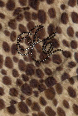 Displays the natural cheetah print 'juicy' branded roll down capri featuring the juicy logo 