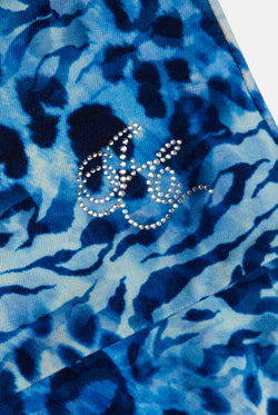 Displays the blue leopard print 'Juicy' branded jersey roll down mini skirt featuring the Juicy Couture logo
