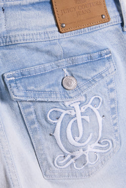 Displays a model wearing the Light wash 'juicy' branded low rise flared embodied jeans 