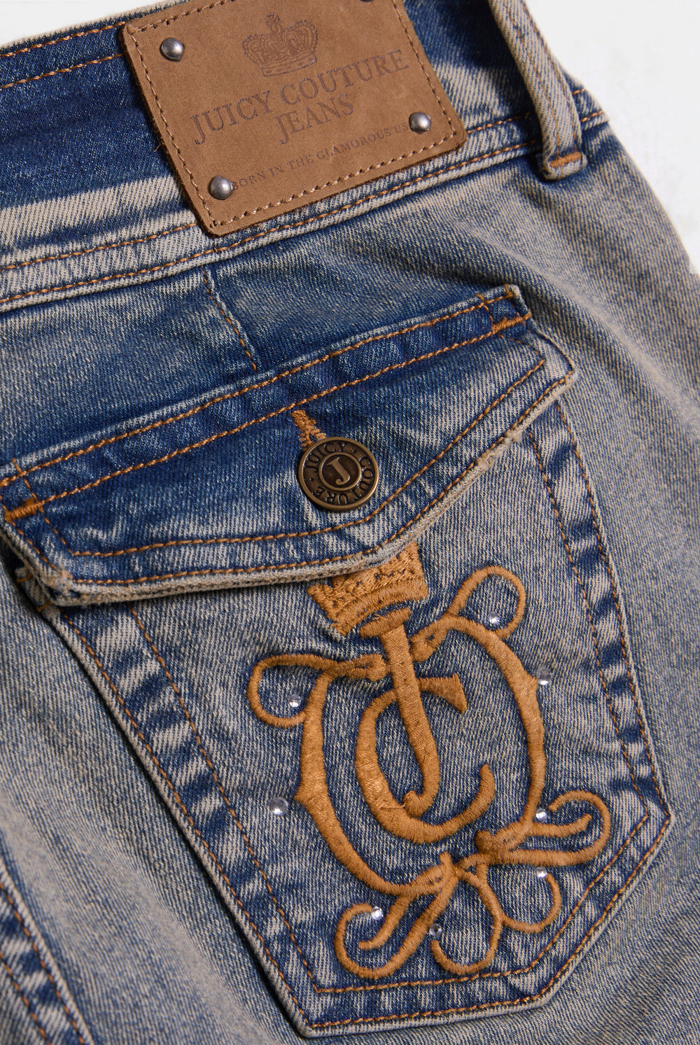 Displays the Vintage Wash 'Juicy' branded Low Rise flared embroiled jeans featuring the juicy Couture branding