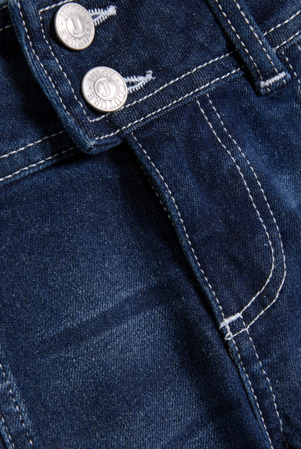 Displays the 'Juicy' branded mid wash low rise flare embroidered jeans